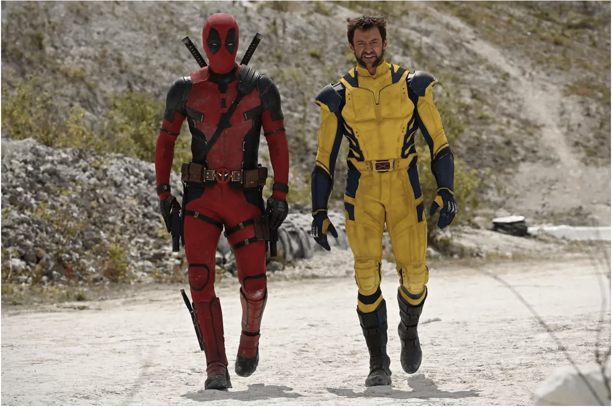 Deadpool (left) and Wolverine (right) standing side by side in uniform.